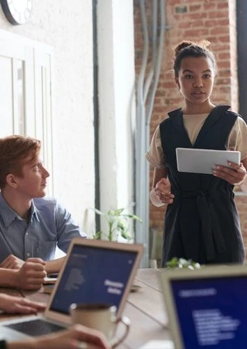 A strategist presenting to a digital team